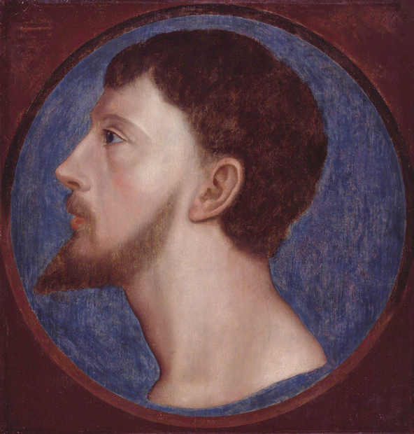 Side-profile portrait of a man with a beard.